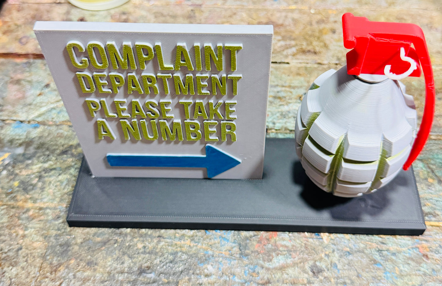 grenade-shaped complaint dispenser