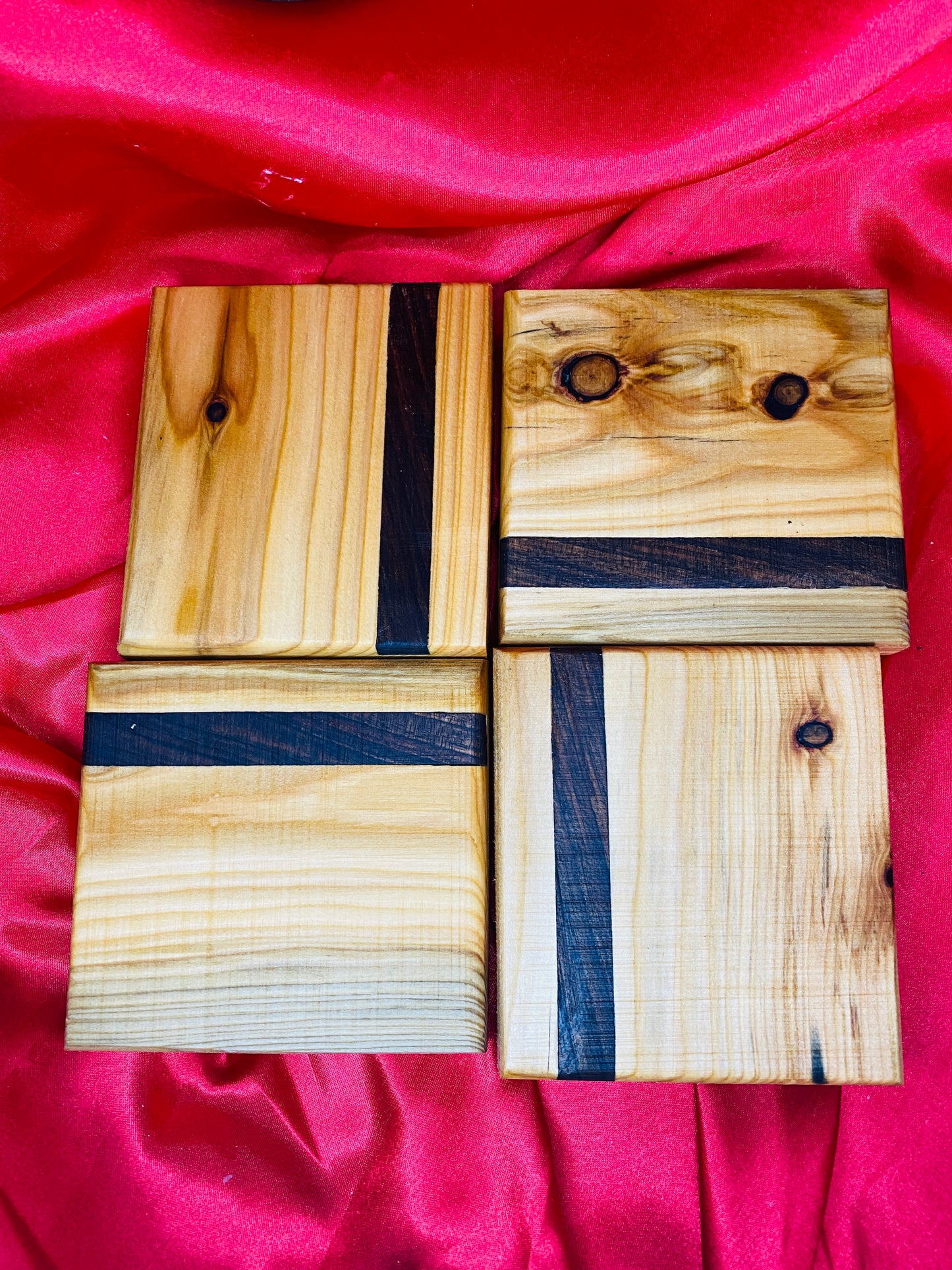 Wooden coasters with mahogany inlay.