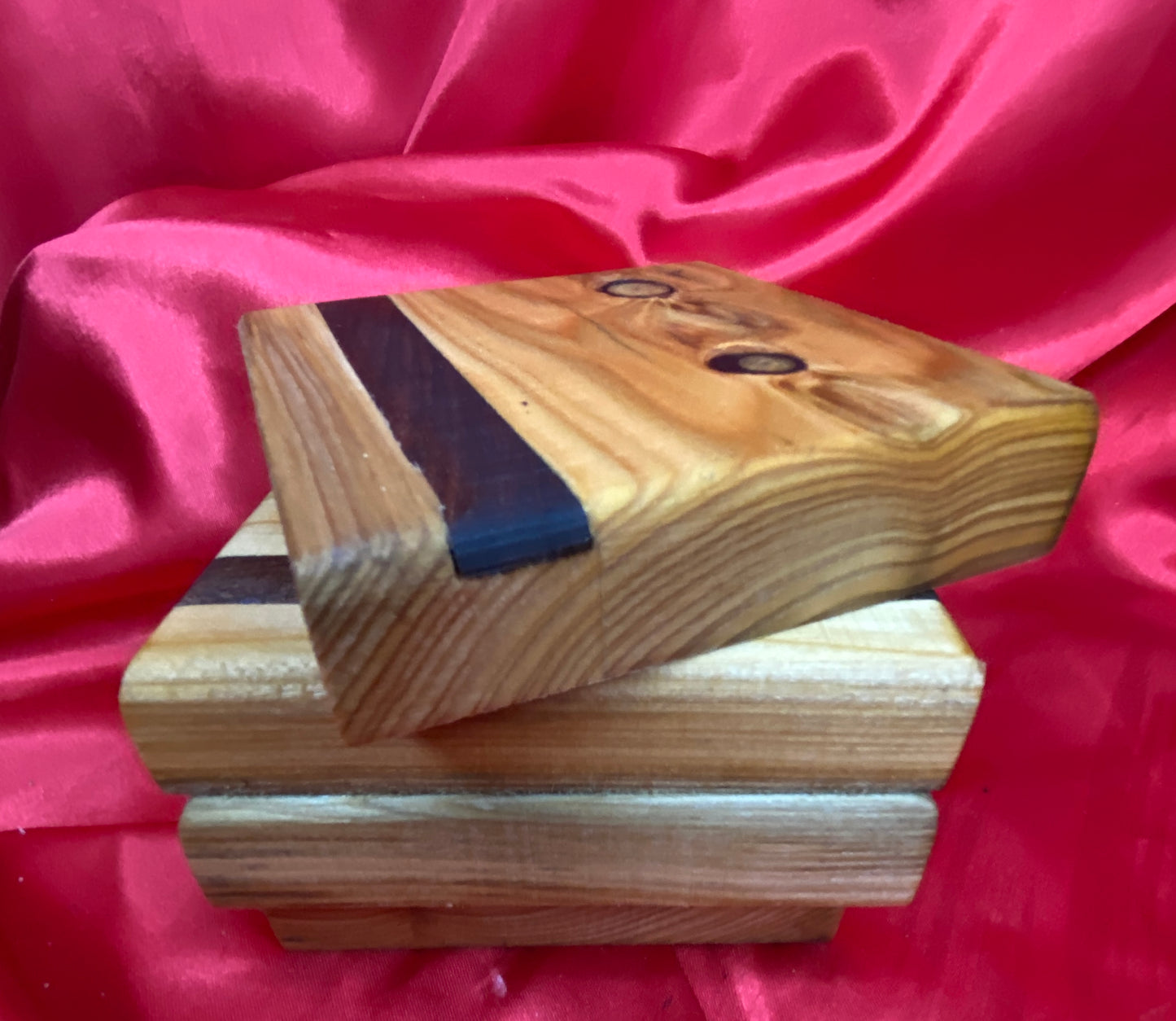 Wooden coasters with mahogany inlay.